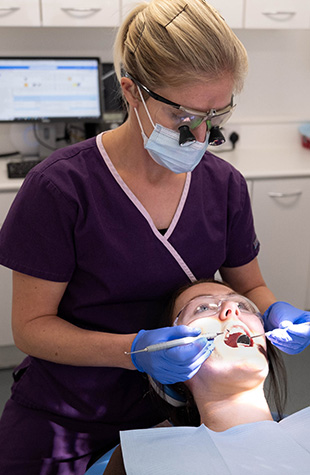Patient getting tooth filling in Ashburton